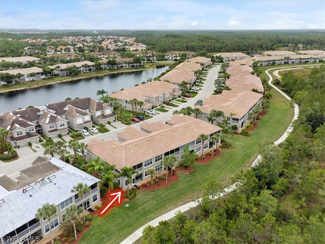 bird's eye view with a water view