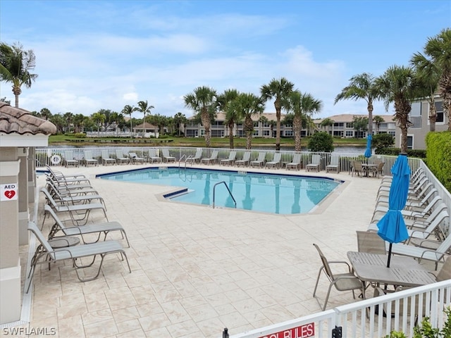 view of swimming pool with a patio