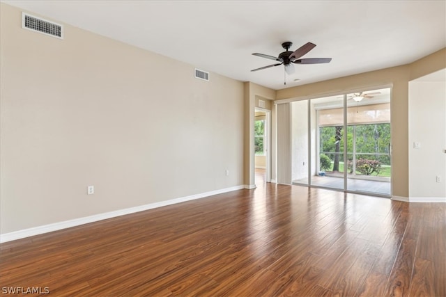 unfurnished room with dark hardwood / wood-style floors and ceiling fan