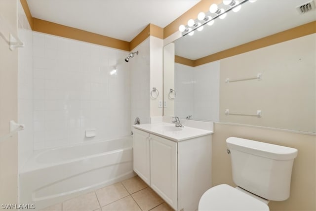 full bathroom with vanity, toilet, tile patterned floors, and tiled shower / bath