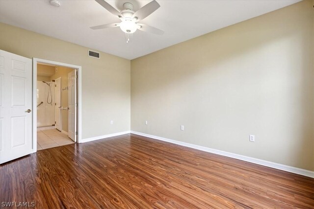 unfurnished room with hardwood / wood-style flooring and ceiling fan