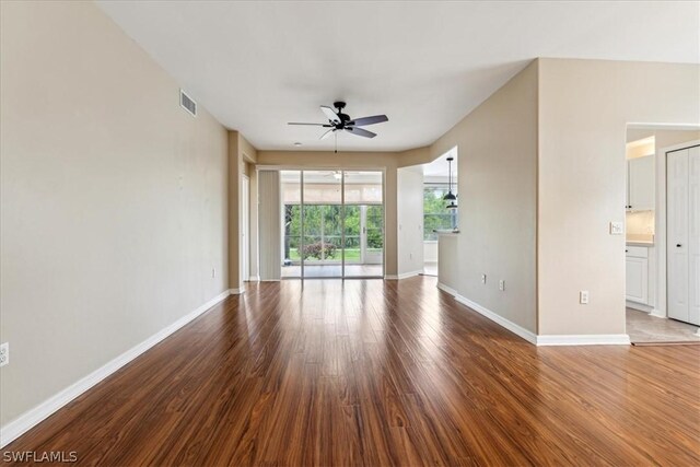 unfurnished room with ceiling fan and wood-type flooring