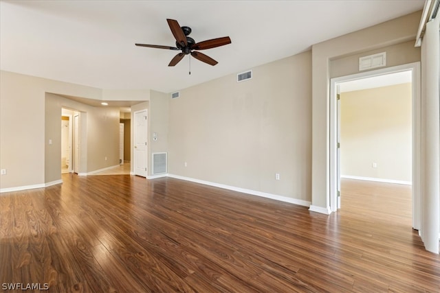 spare room with ceiling fan and wood-type flooring