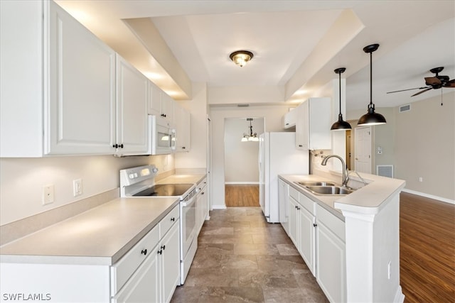 kitchen with white cabinets, wood-type flooring, ceiling fan, and white appliances