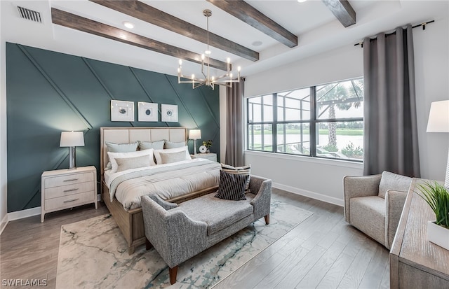 bedroom with wood-type flooring, a chandelier, and beamed ceiling