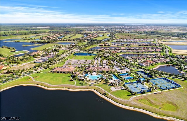 birds eye view of property with a water view