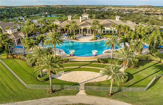 view of pool with a yard and a patio area