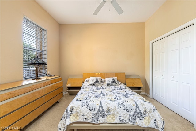 bedroom with carpet flooring, ceiling fan, and a closet