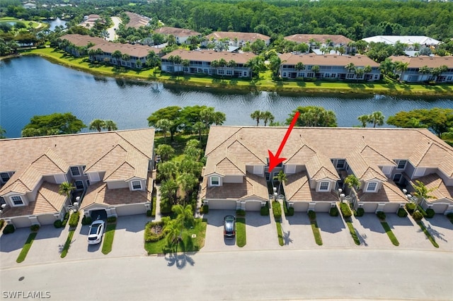 birds eye view of property with a water view