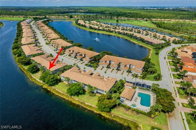 birds eye view of property with a water view