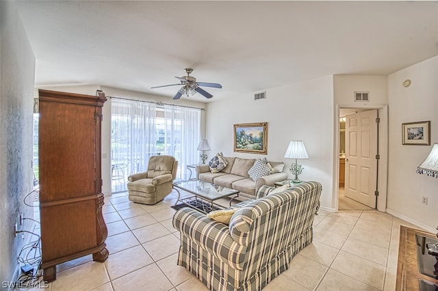 living room with ceiling fan and light tile floors