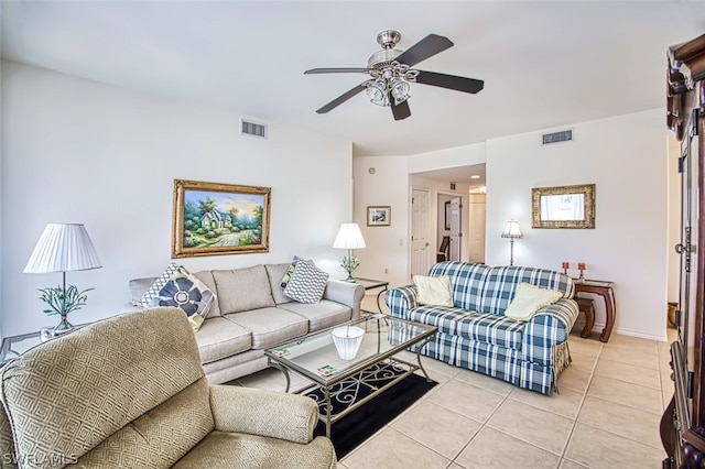 tiled living room with ceiling fan