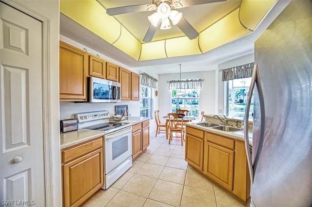 kitchen featuring ceiling fan, white electric range, a raised ceiling, sink, and refrigerator