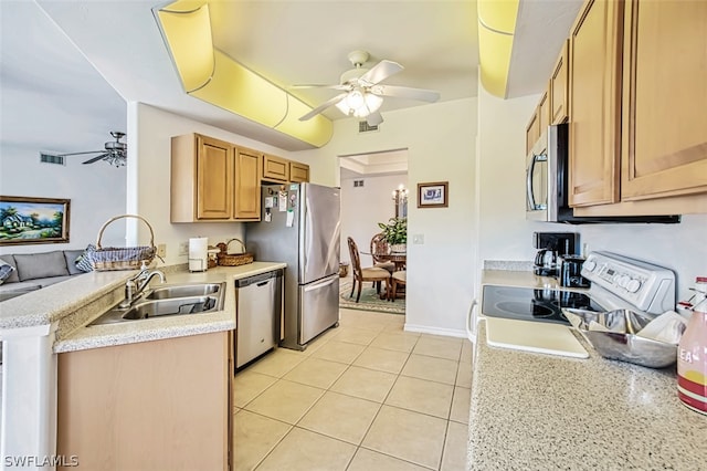 kitchen featuring appliances with stainless steel finishes, sink, ceiling fan, and light tile floors