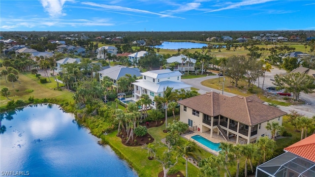 birds eye view of property with a water view