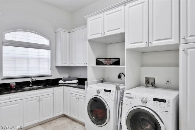 laundry area with washing machine and dryer, light tile flooring, washer hookup, sink, and cabinets