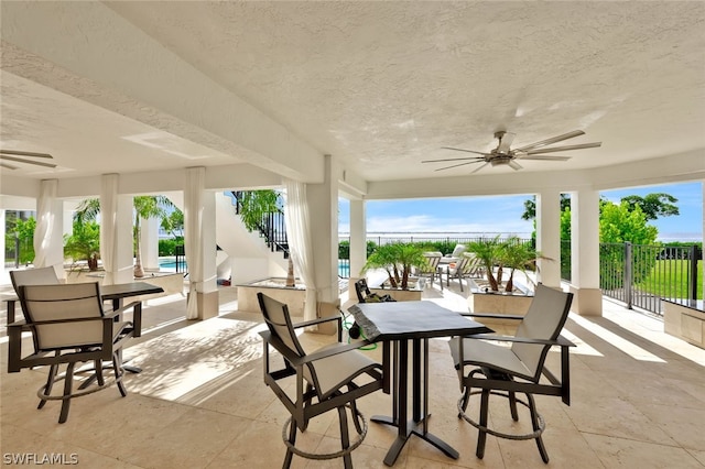 view of terrace with ceiling fan