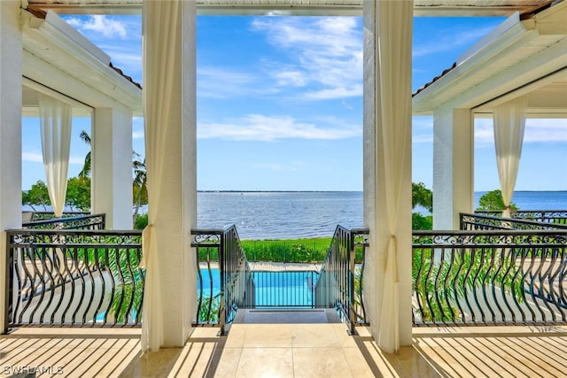 balcony featuring a water view