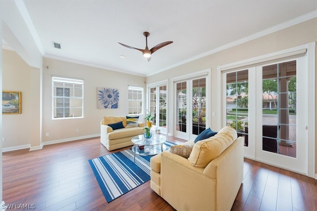 living room with dark hardwood / wood-style flooring, ceiling fan, french doors, and ornamental molding