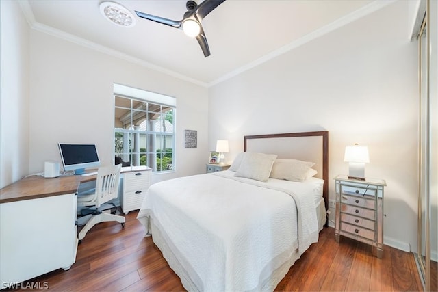 bedroom featuring ceiling fan, dark hardwood / wood-style floors, and ornamental molding