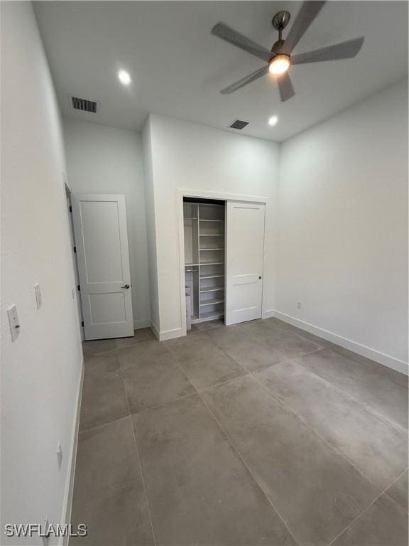 unfurnished bedroom with a closet and ceiling fan