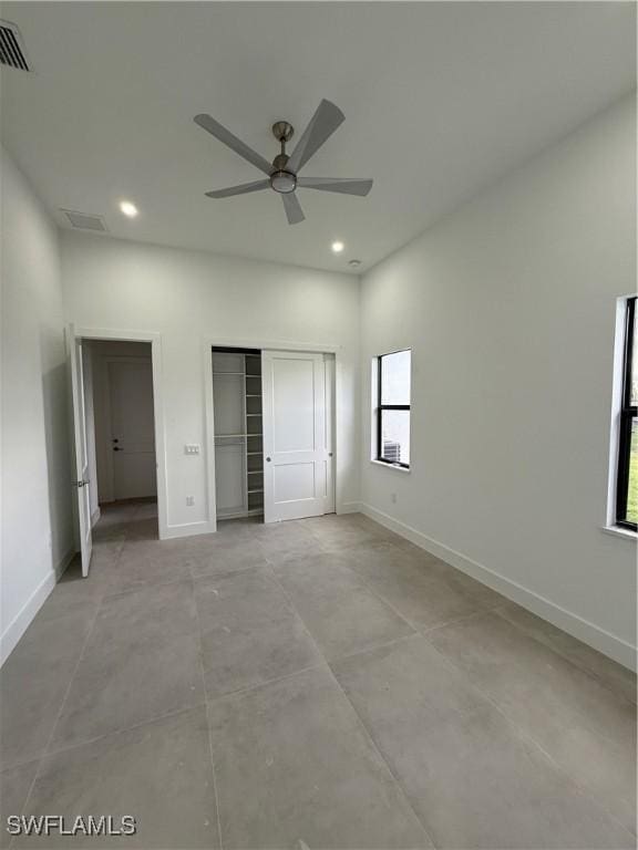 unfurnished bedroom with a closet and ceiling fan