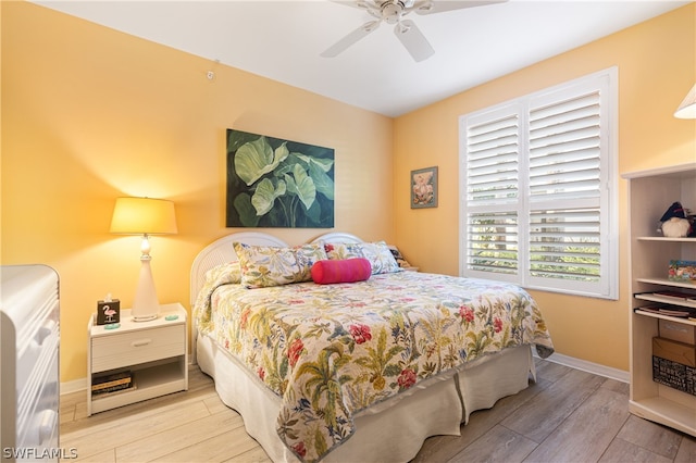 bedroom featuring ceiling fan and hardwood / wood-style floors