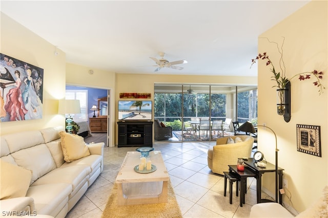 tiled living room featuring ceiling fan