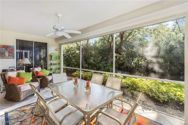 sunroom / solarium featuring ceiling fan