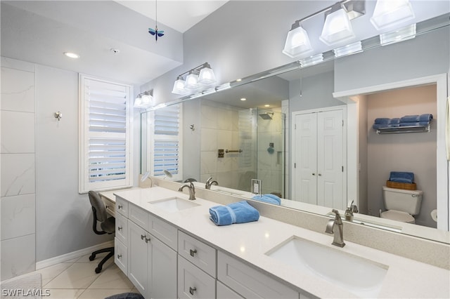 bathroom featuring vanity, an enclosed shower, tile patterned floors, and toilet