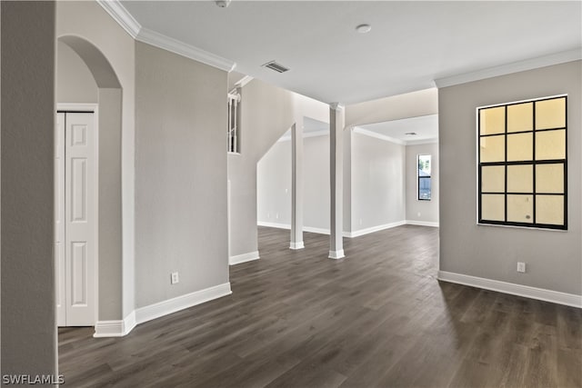 interior space with crown molding and dark hardwood / wood-style flooring