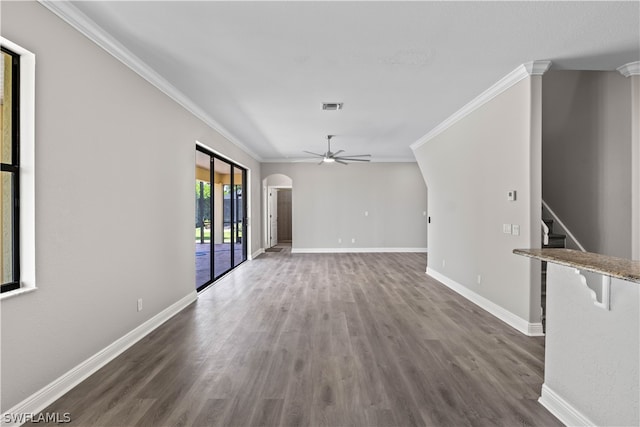 unfurnished room with crown molding, ceiling fan, and dark hardwood / wood-style floors