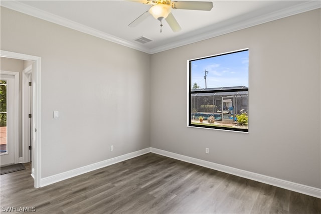 unfurnished room with hardwood / wood-style floors, ceiling fan, and crown molding