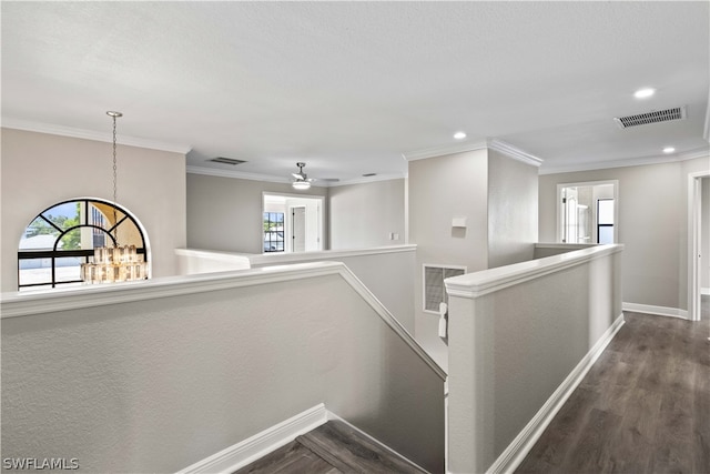 hall featuring ornamental molding and dark wood-type flooring