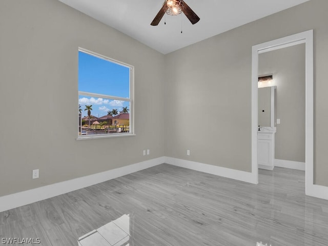 unfurnished room featuring light hardwood / wood-style flooring and ceiling fan