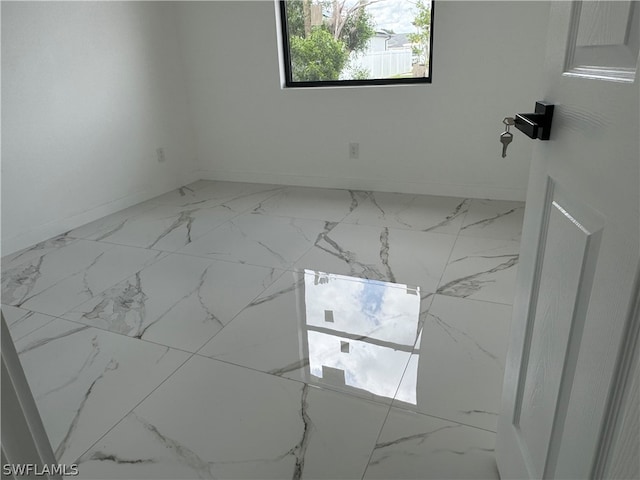 empty room featuring tile floors