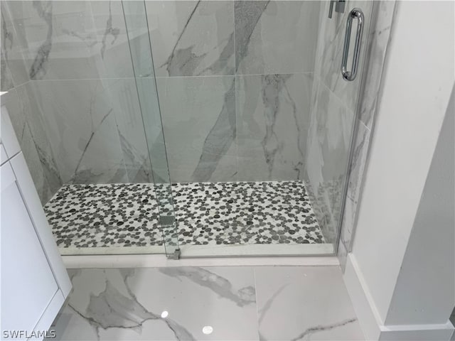 bathroom with a shower with shower door