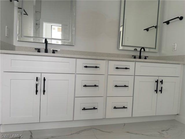 bathroom with tile flooring and vanity