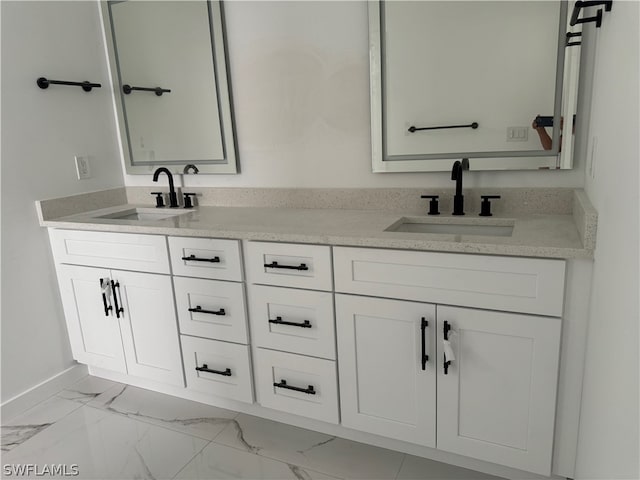 bathroom with tile flooring and double vanity