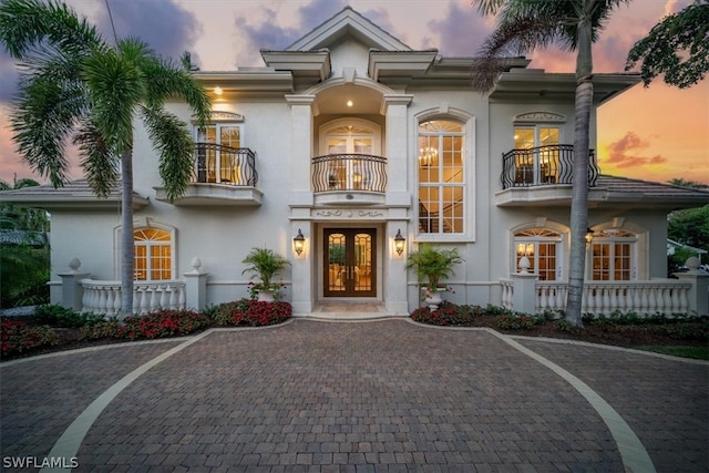 mediterranean / spanish home with a balcony