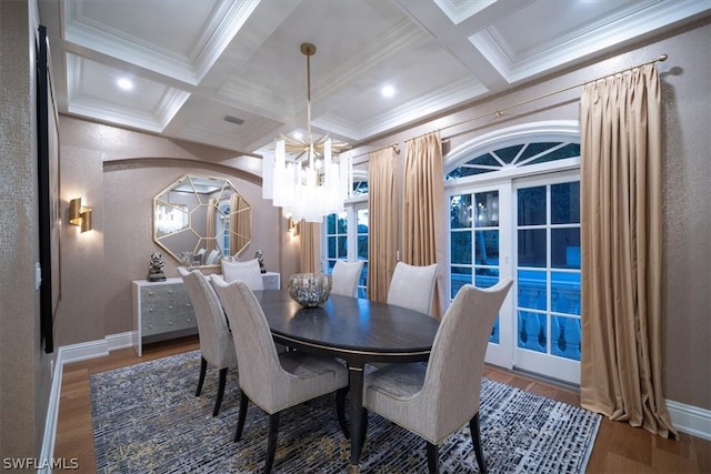 dining space featuring hardwood / wood-style floors, beam ceiling, a chandelier, and coffered ceiling