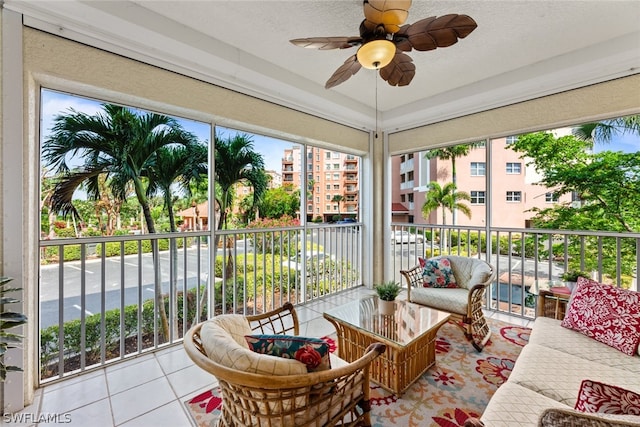 sunroom featuring ceiling fan