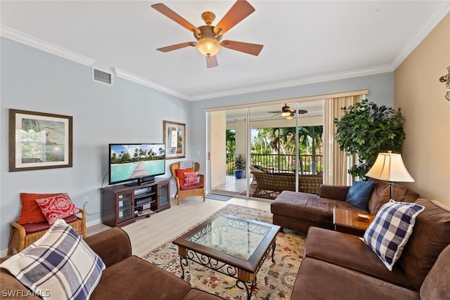 living room featuring crown molding, wood-type flooring, and ceiling fan