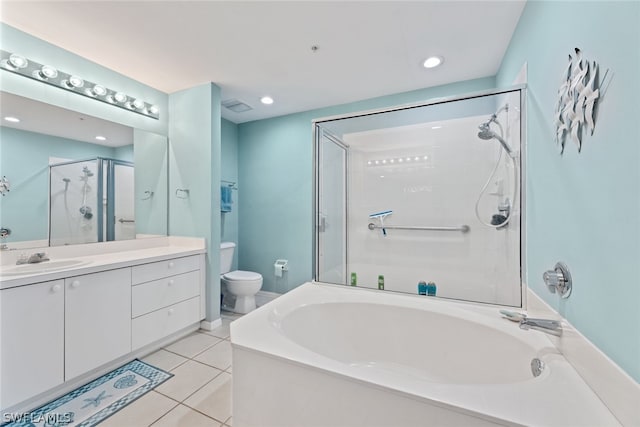 full bathroom featuring vanity, tile flooring, shower with separate bathtub, and toilet