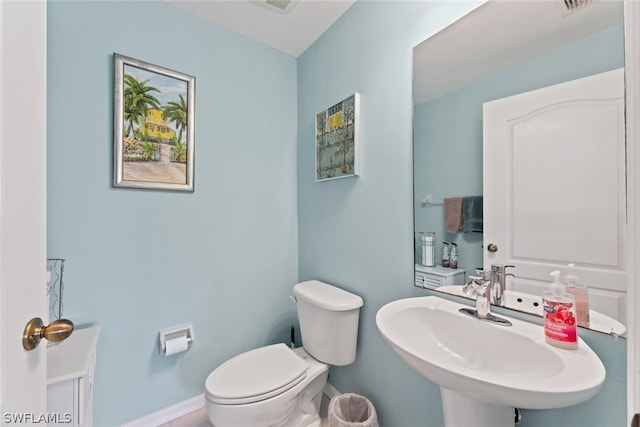 bathroom with sink and toilet