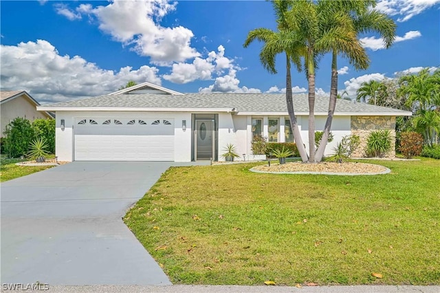 single story home featuring a garage and a front lawn