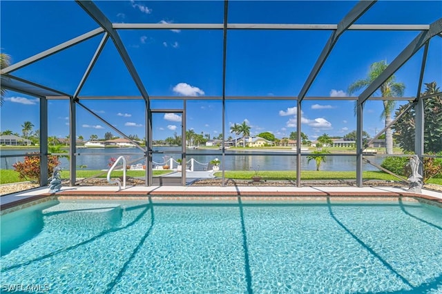 view of pool with a lanai and a water view