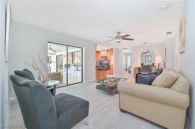 living room featuring ceiling fan