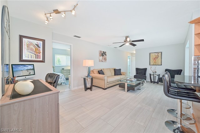 living room featuring ceiling fan