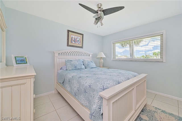 bedroom with ceiling fan and light tile patterned floors